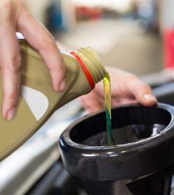 Certified mechanic performing expert oil change Arlington TX at Arlington Auto Pros to protect engine and ensure reliable vehicle performance