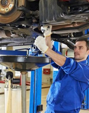 Certified technician performing expert wheel alignment Arlington TX at Arlington Auto Pros shop to ensure smooth handling and longer tire life